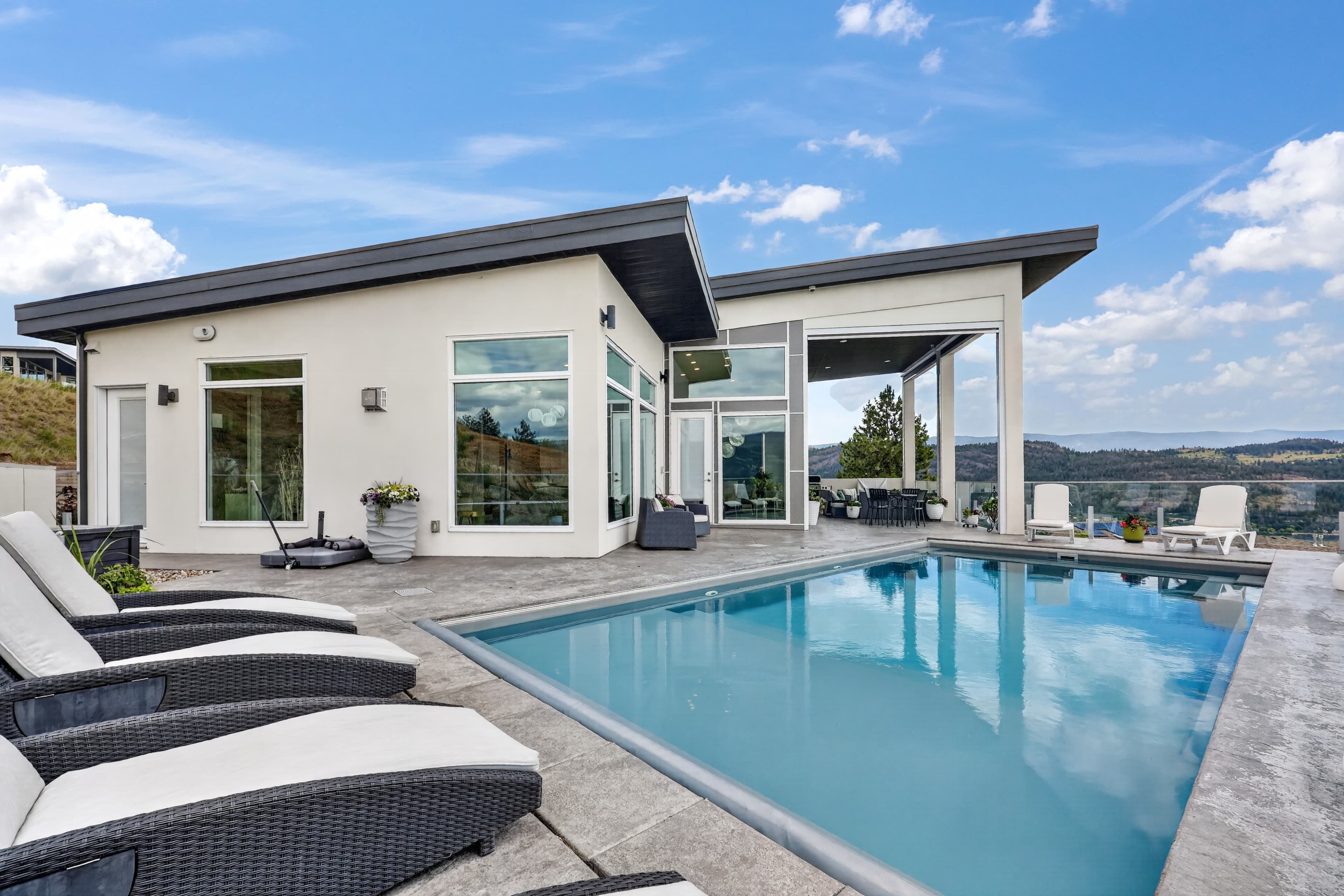 Original daylight photograph of a poolside home