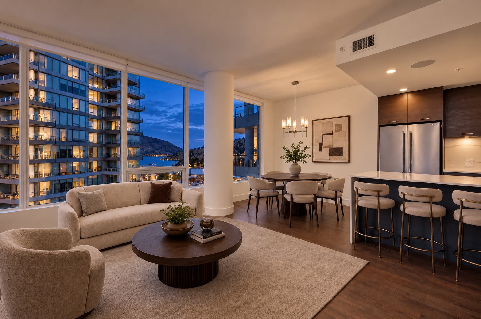 Furnished condo relit in Blue Hour with evening light outside the windows