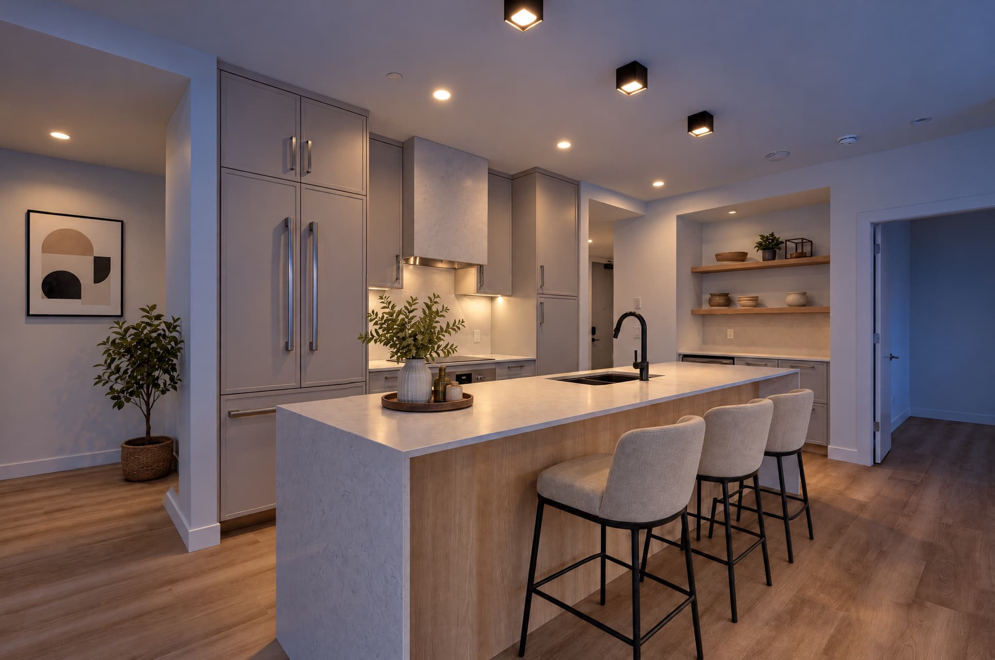 A kitchen relit in Blue Hour with straight cabinetry and warm practical lights