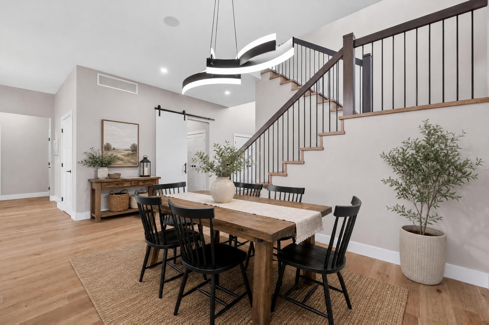 Furnished dining room before lighting-focused editing