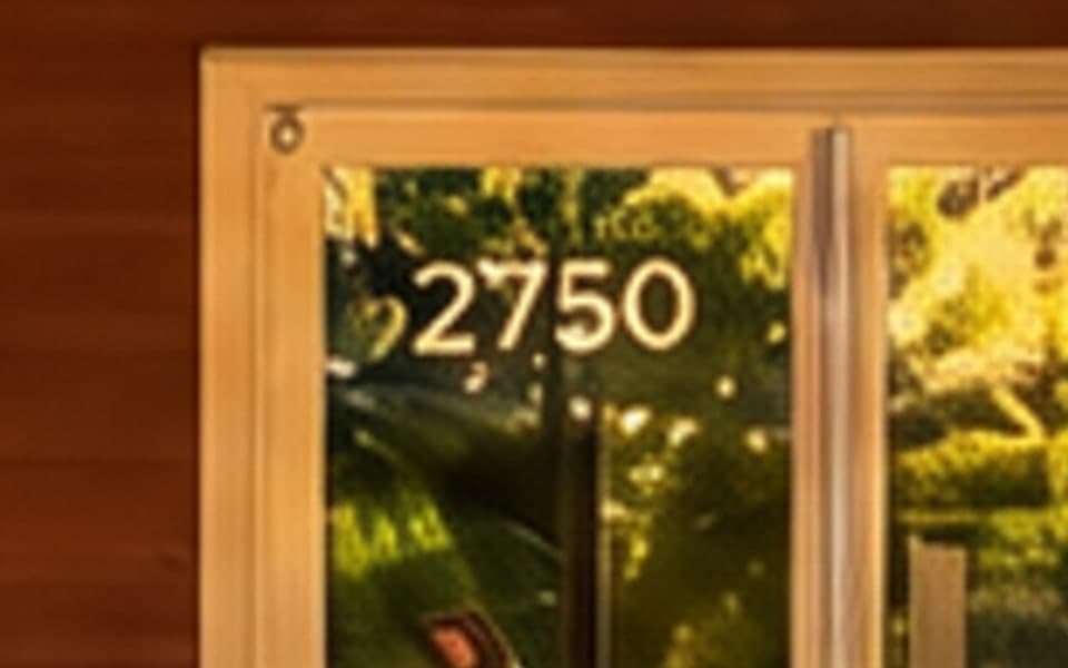 The relit door with the house number repaired to 2750