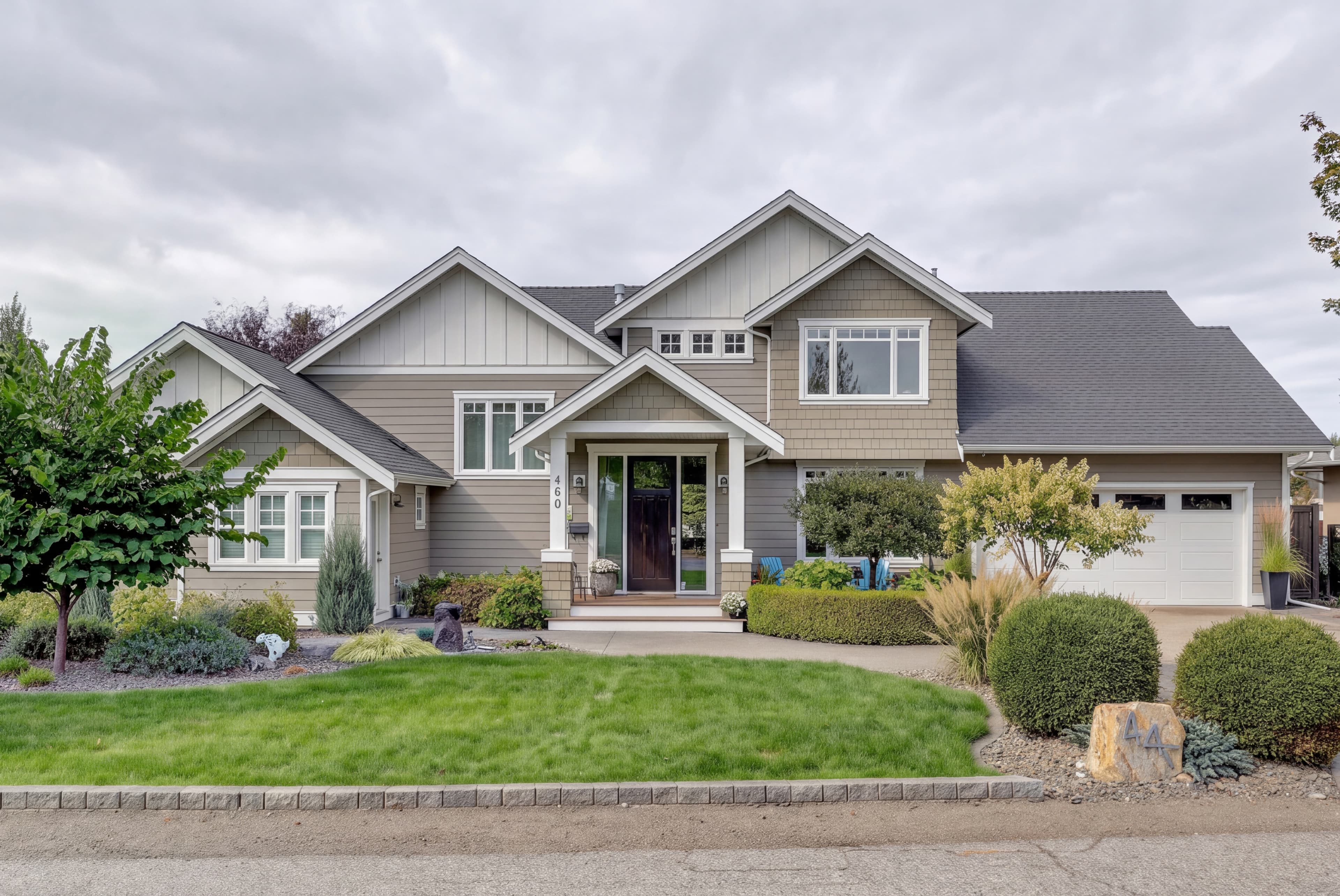 Cloudy original: the same detached house and landscaped front yard