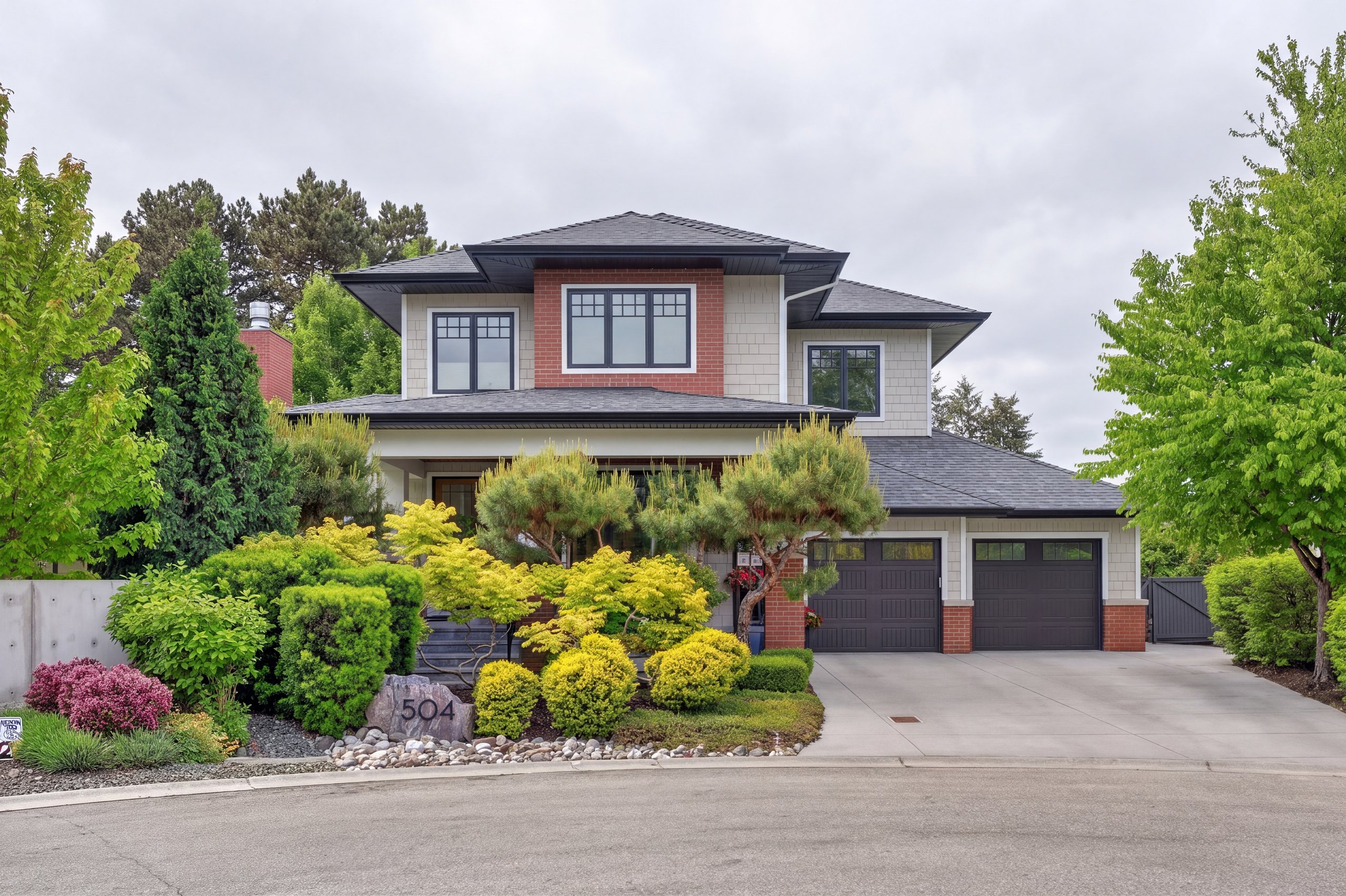 Cloudy original: Two-storey home with mature landscaping